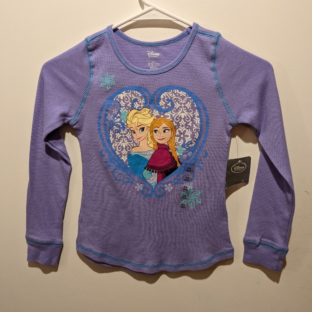 NWT. Disney's Frozen in a heart printed on front of the shirt. Size 5/6